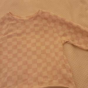 A pink and white checkered carter's size twelve top.